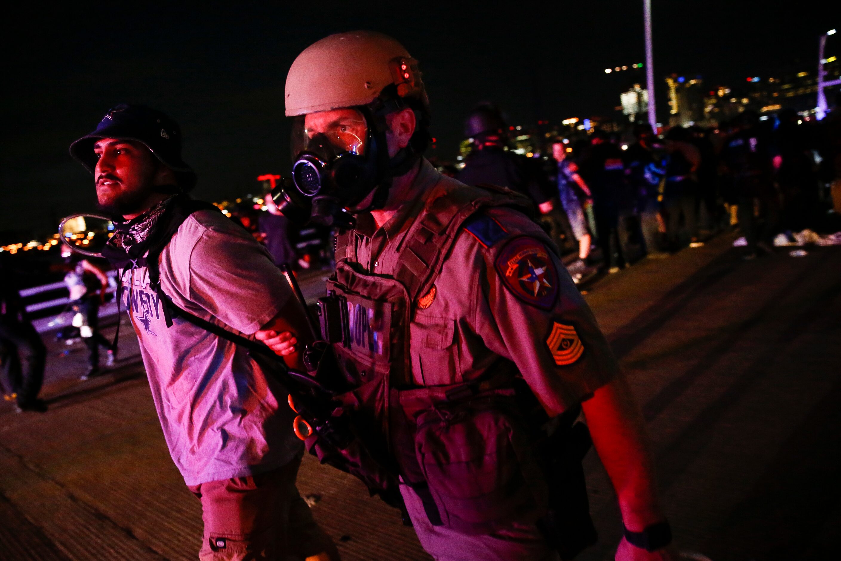 Police surround and detain hundreds of protesters who marched onto the Margaret Hunt Hill...