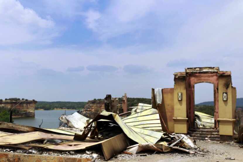 Only the door frame remains standing after wildfires ravaged a once-grand home overlooking...