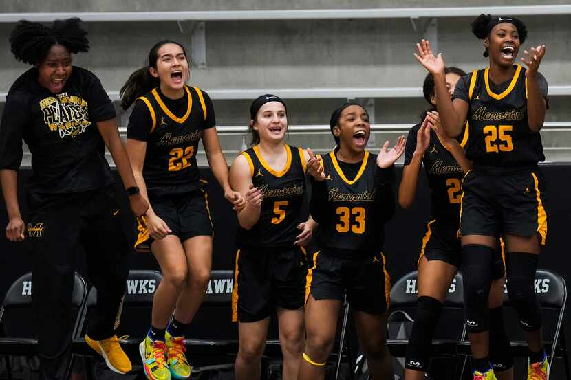 Frisco Memorial players celebrate on the bench as time expires on a 44-42 victory over Wylie...