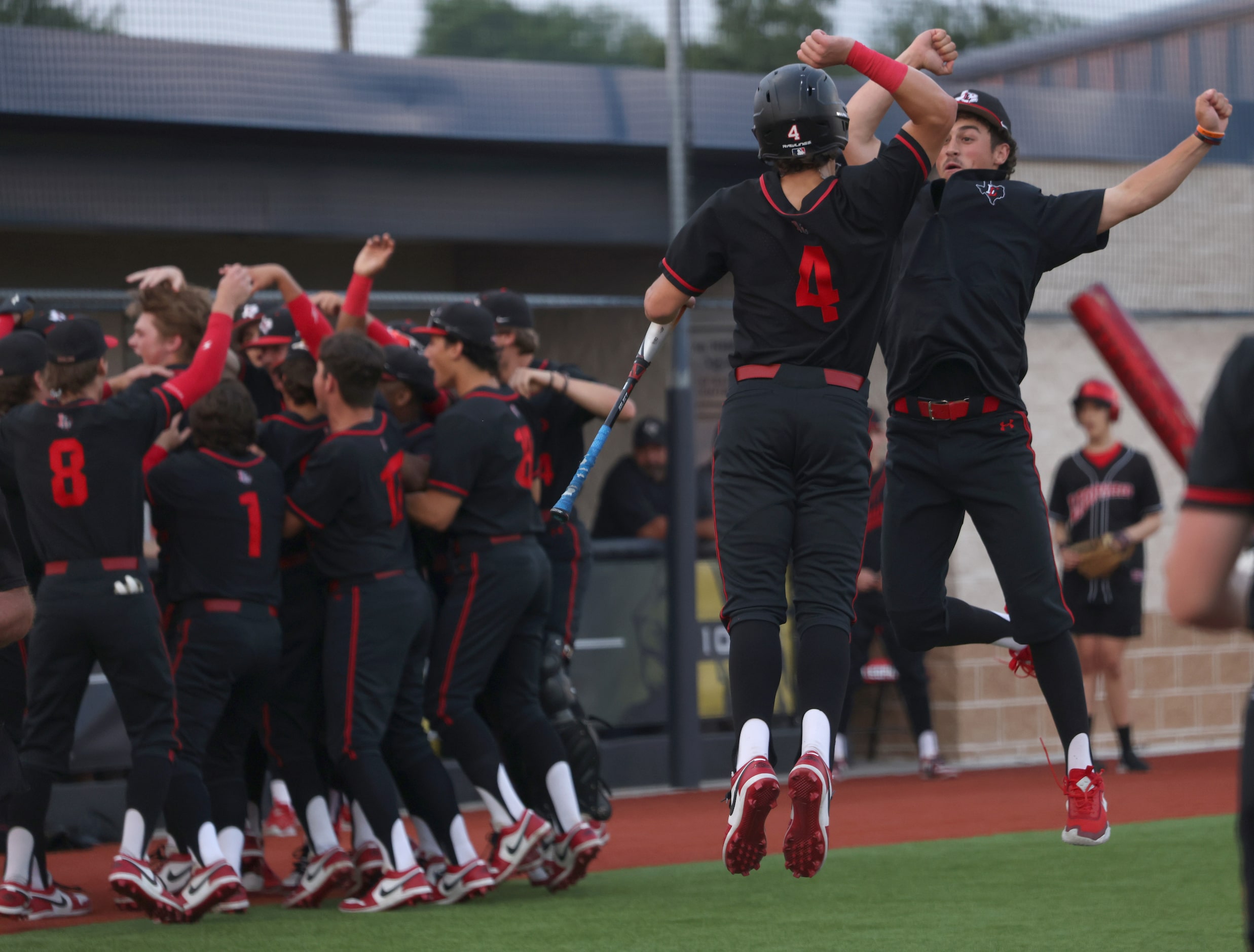 Lucas Lovejoy's Kyle Branch (4), and Grant Harland, both right, leap in celebration as...