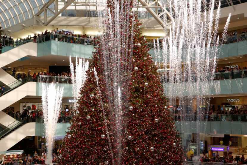 Galleria Dallas shoppers watched the Christmas tree lighting ceremony one Black Friday. 