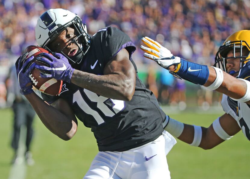 FILE - TCU wide receiver Jalen Reagor (18) catches a third quarter touchdown pass as West...