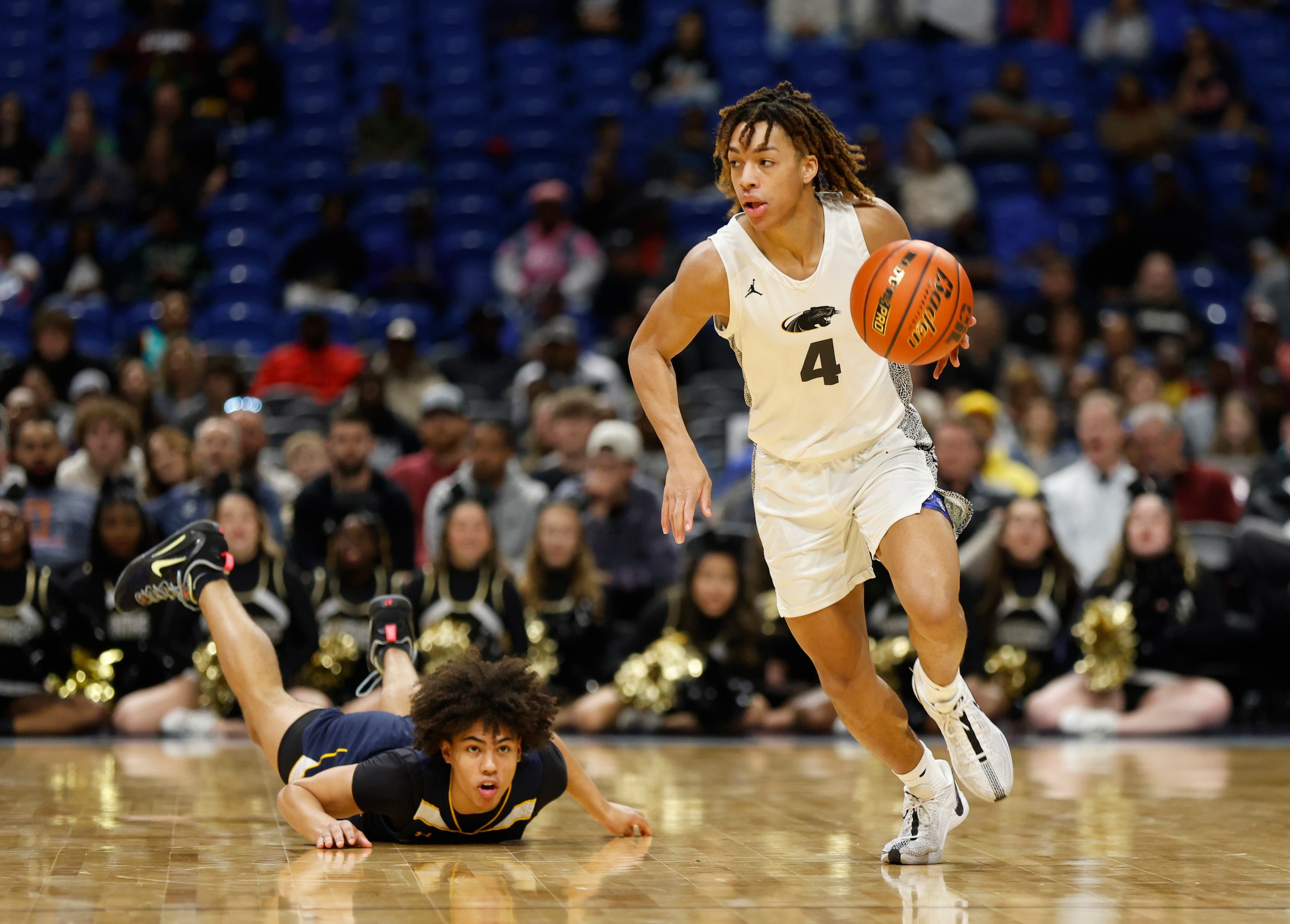 Plano East's Jordan Mizell (4) steals the ball from Round Rock Stony Point's Junior Goodlet...