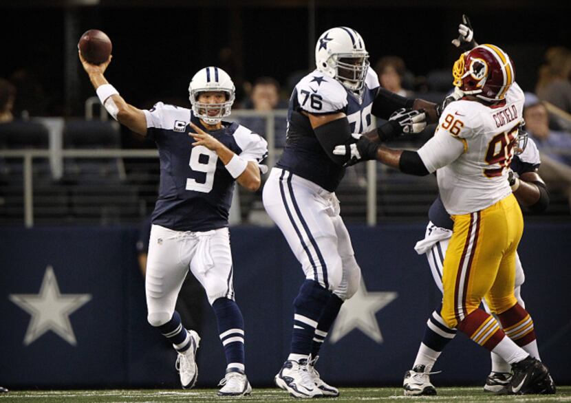 Dallas Cowboys quarterback Tony Romo (9) throws with protection in the first quarter against...