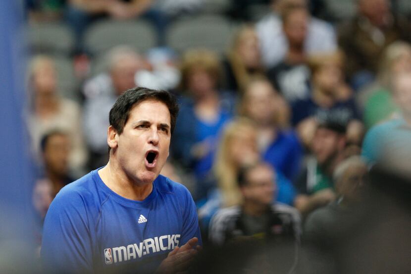 Dallas Mavericks owner Marc Cuban yells in the second half against Charlotte Hornets at...