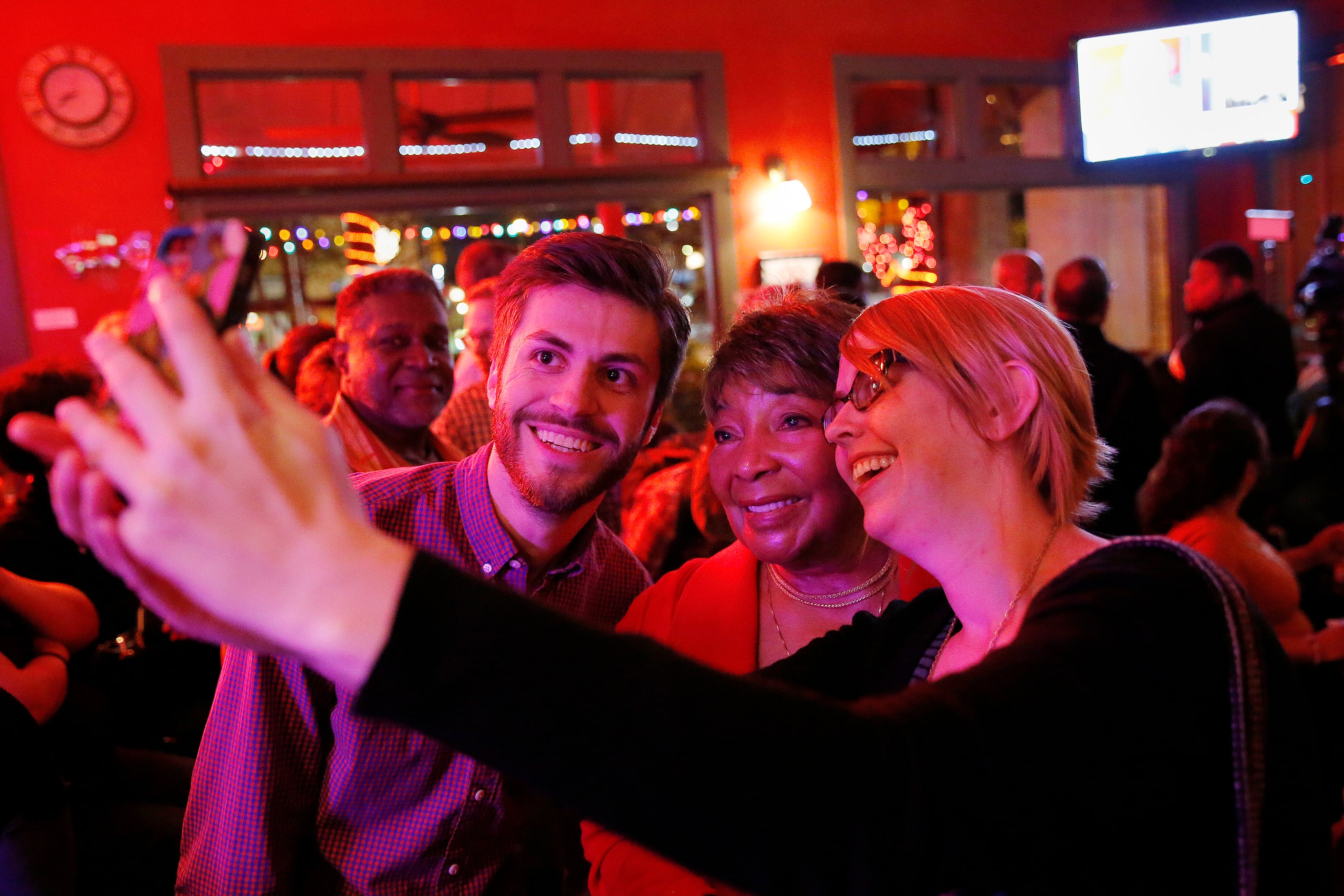 Eddie Bernice Johnson supporters Colin Davis (left) and Amanda Jones (right), both of...