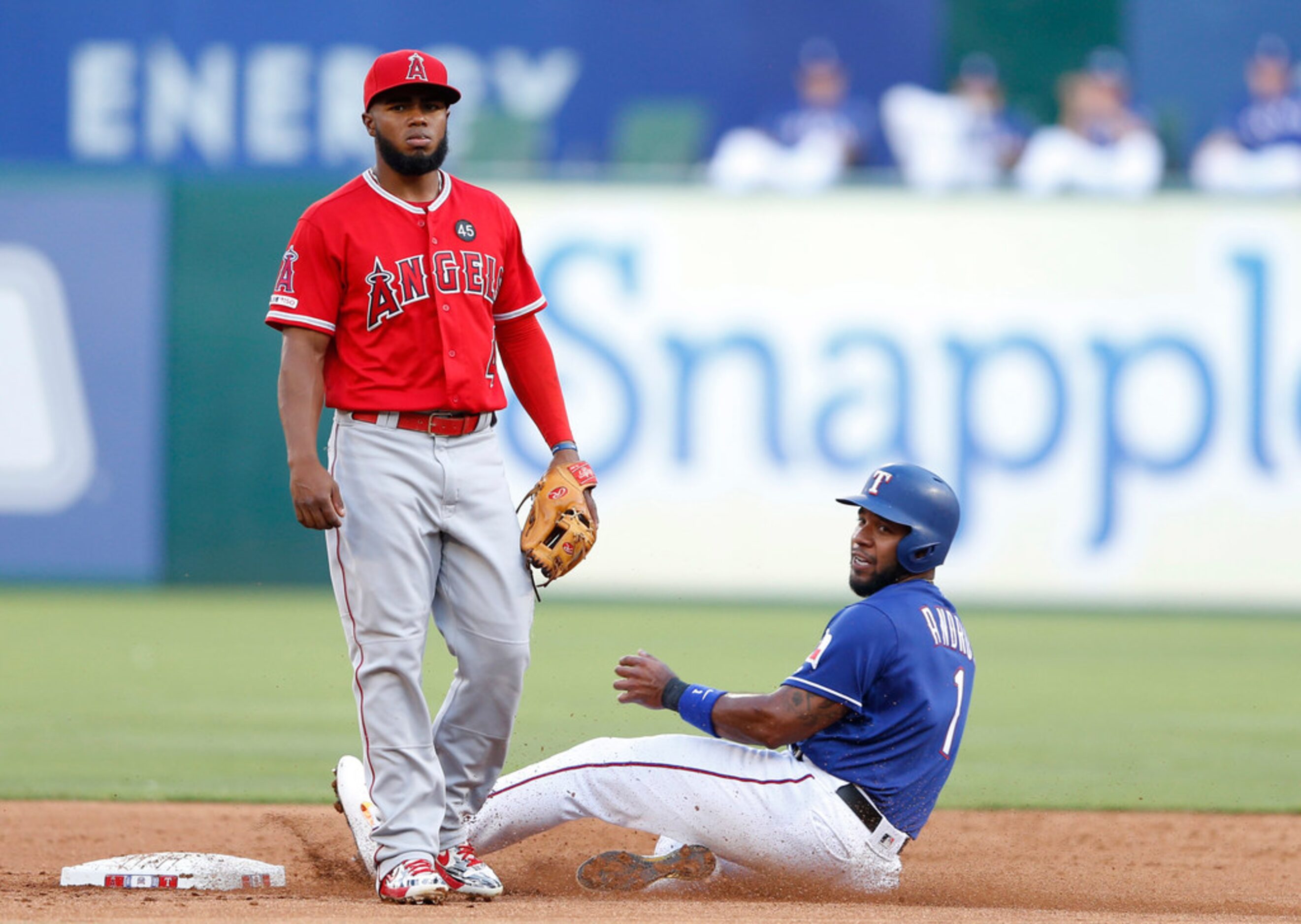 Texas Rangers shortstop Elvis Andrus (1) safely steals second base as Los Angeles Angels...