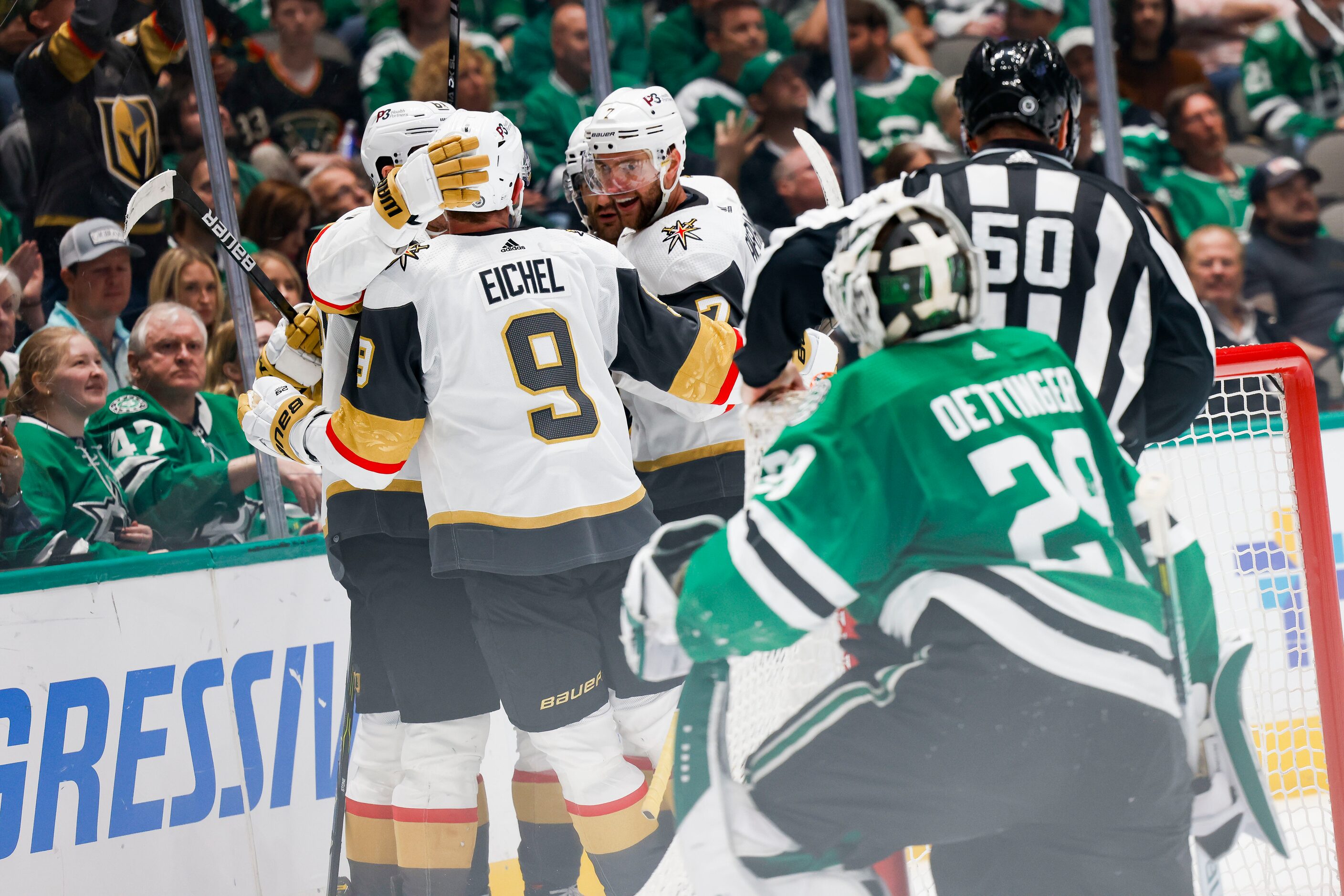 Vegas Golden Knights celebrate after Dallas Stars goaltender Jake Oettinger (29) failed to...