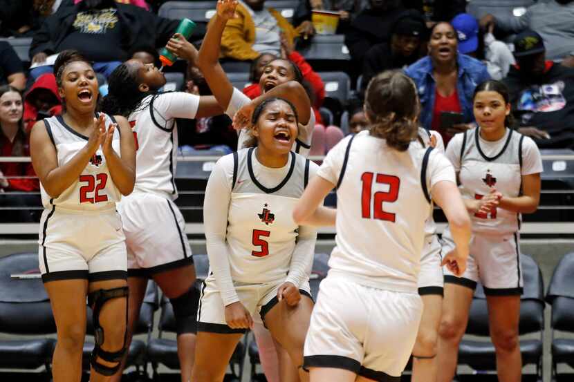 Frisco Liberty players, including Frisco Liberty High’s G Keyera Roseby (5), Frisco Liberty...