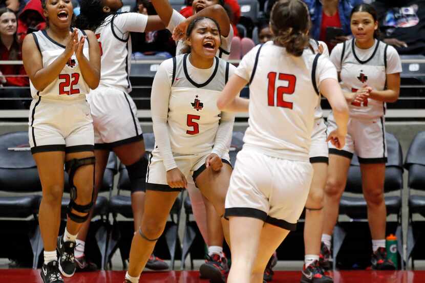 Frisco Liberty players, including Frisco Liberty High’s G Keyera Roseby (5), Frisco Liberty...