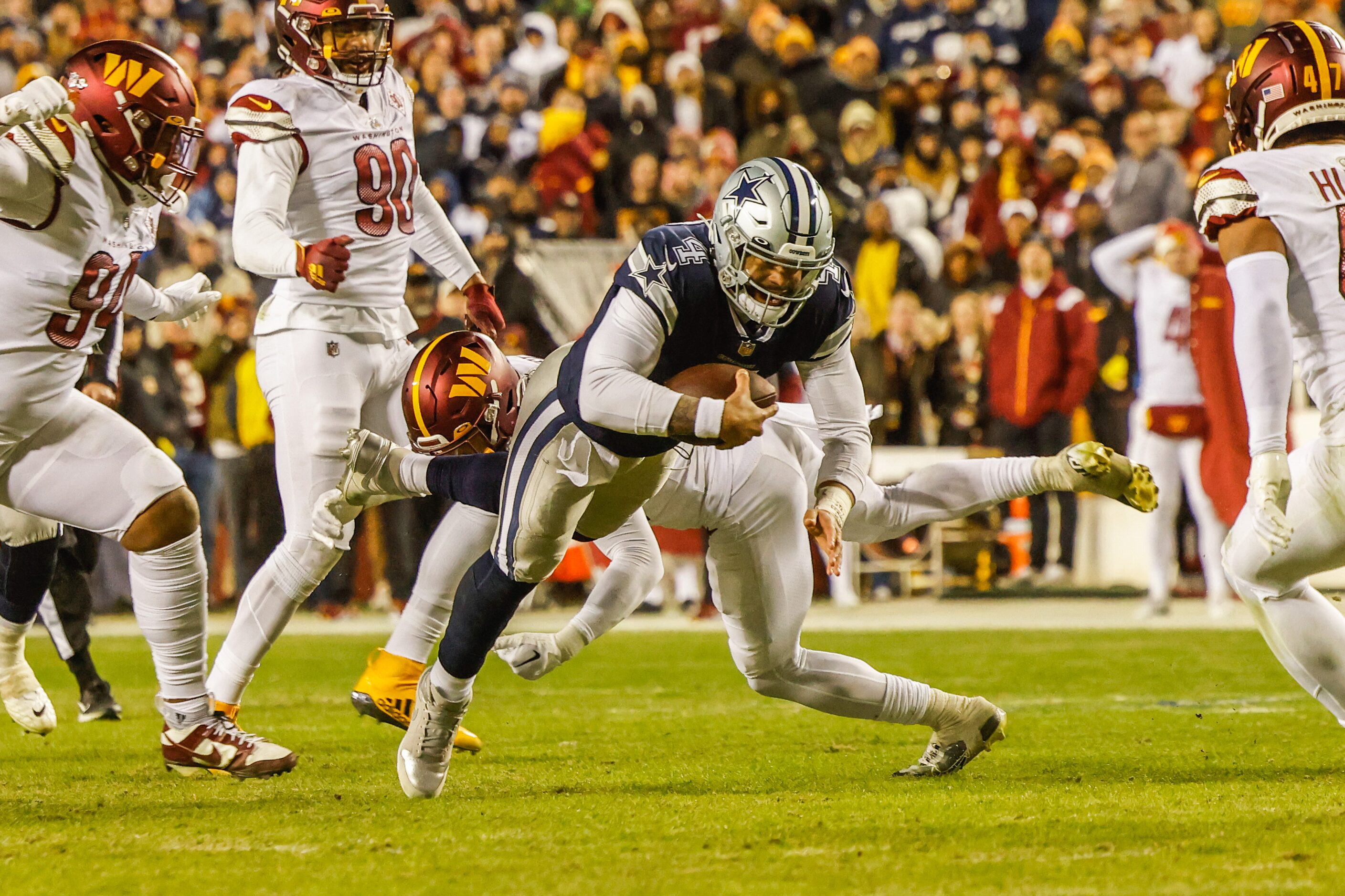 Dallas Cowboys quarterback Dak Prescott (4) dives with the football against Washington...