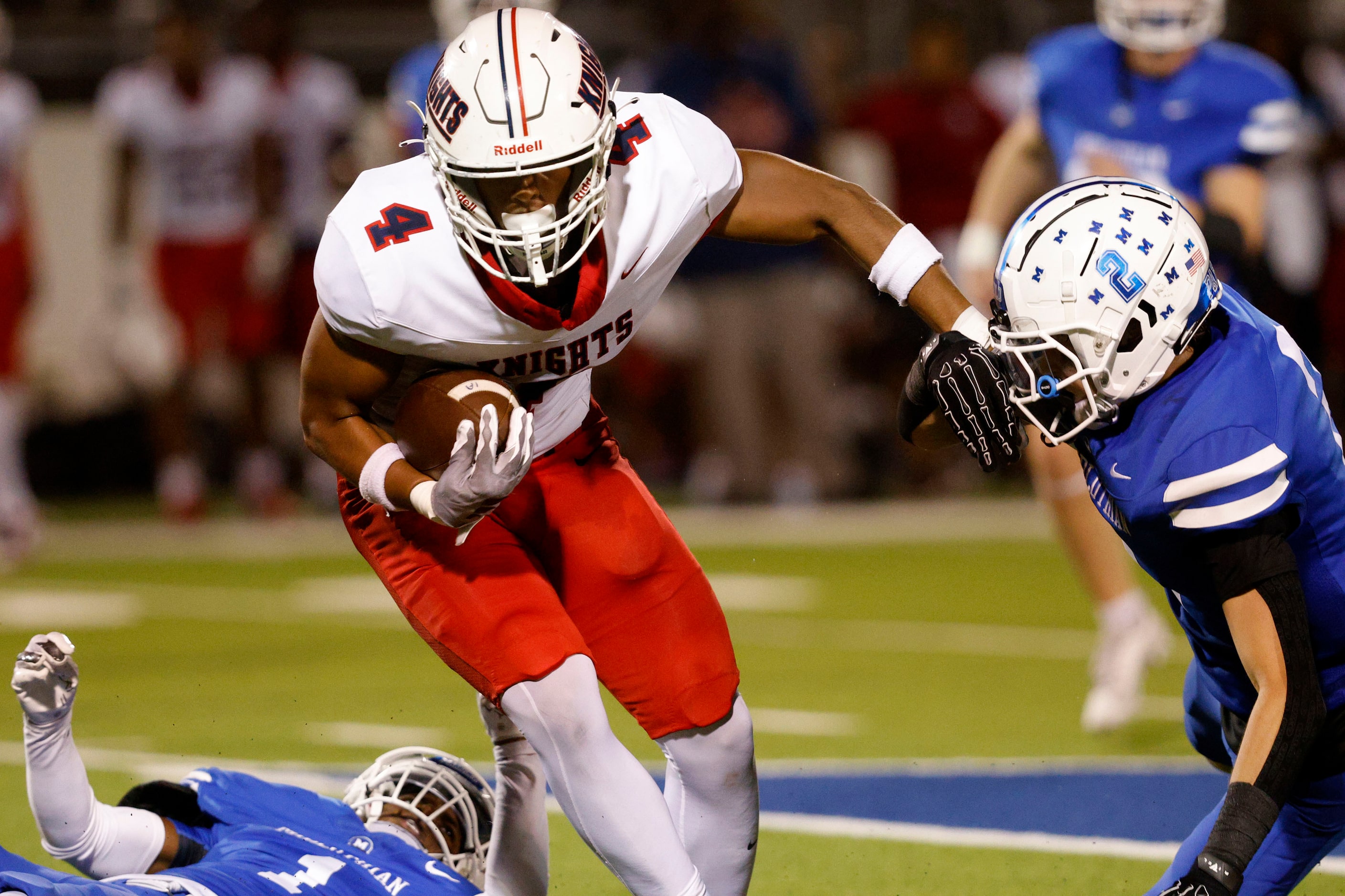 Kimball's Jaylen Mosley (4) carries the ball against Kimball's Armirie Williams-Hall (2) in...