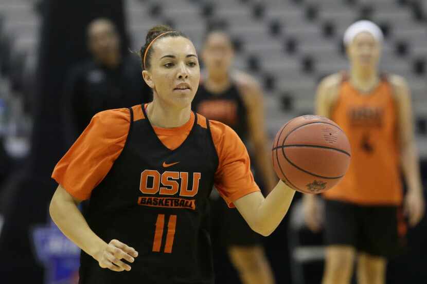 Oregon State guard Gabriella Hanson (11) dribbles during college basketball practice in the...