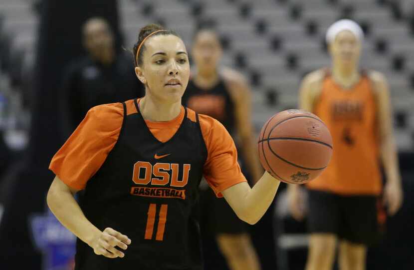 Oregon State guard Gabriella Hanson (11) dribbles during college basketball practice in the...