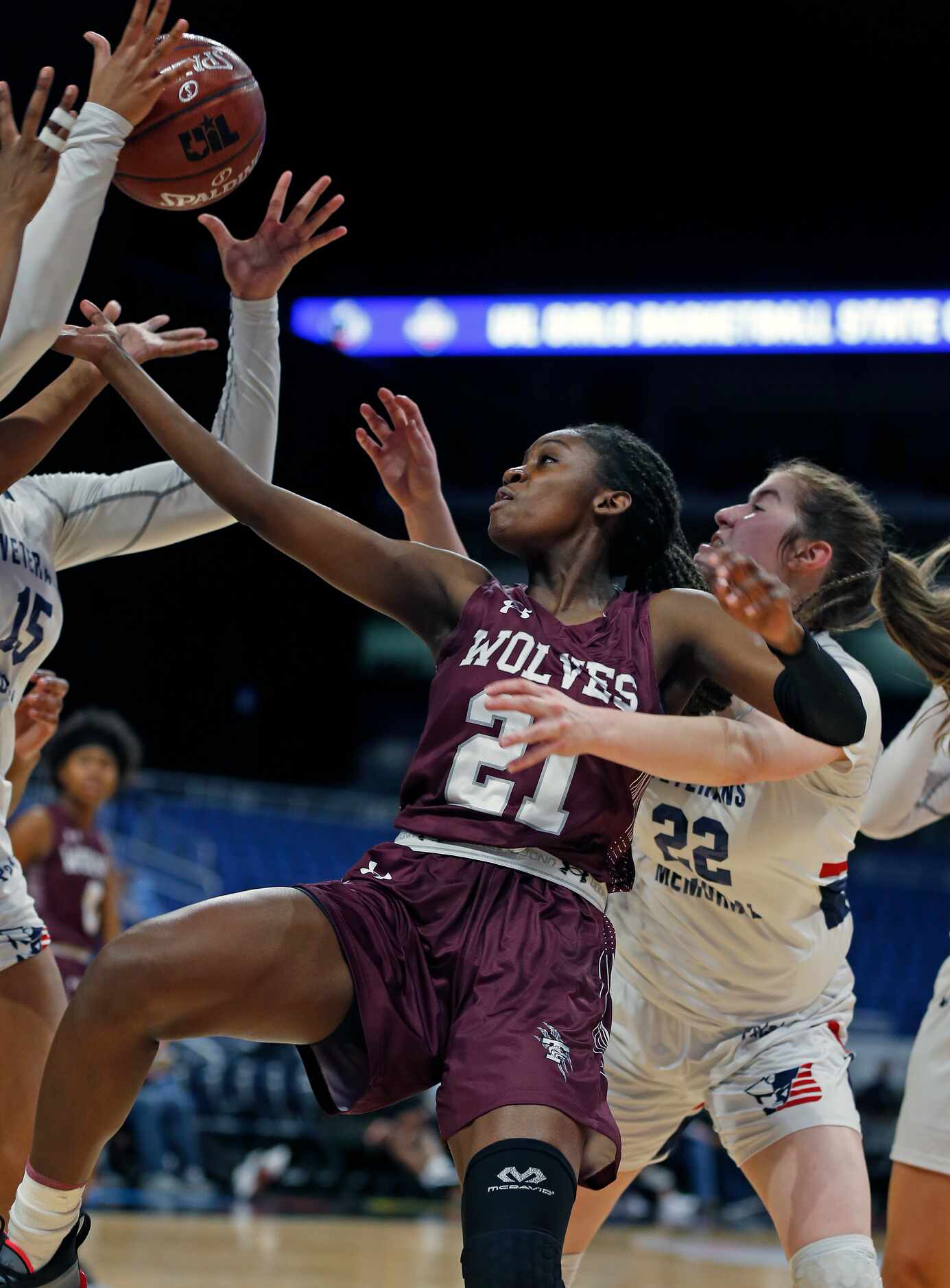 Mansfield Timberview Forward Stephanie Mosley #21 foes for a rebound against Veterans...