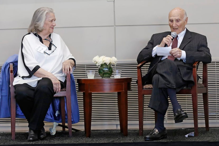 
Miller gave a short speech as his wife, Shirley, looked on.
