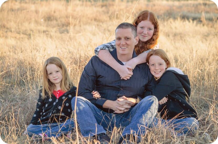 
Kevin Cobb takes a photo with his daughters, (from left) Sam, 7, Liz, 15, and Abby, 10.
