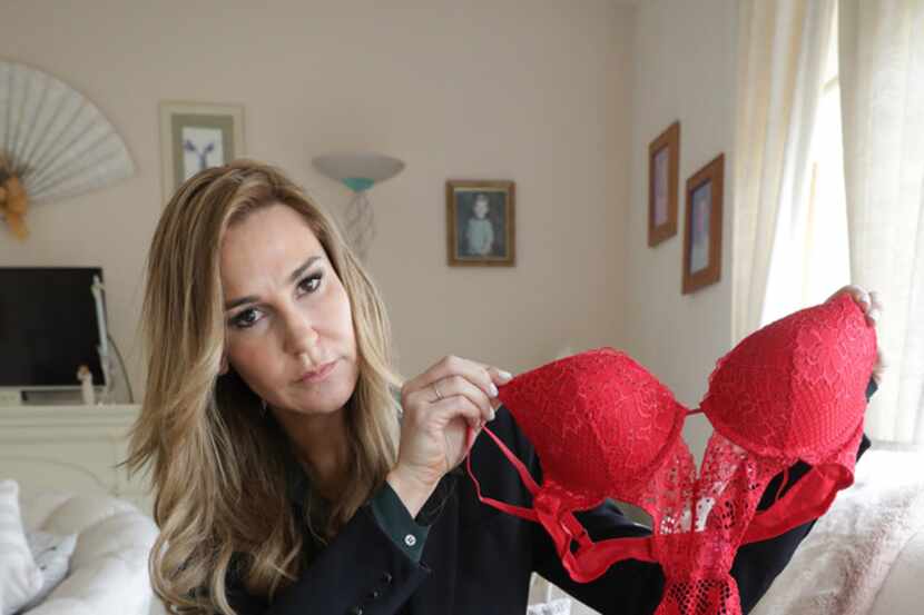Attorney Tamara Holder displays racy lingerie and a uniform top worn by some of her clients...