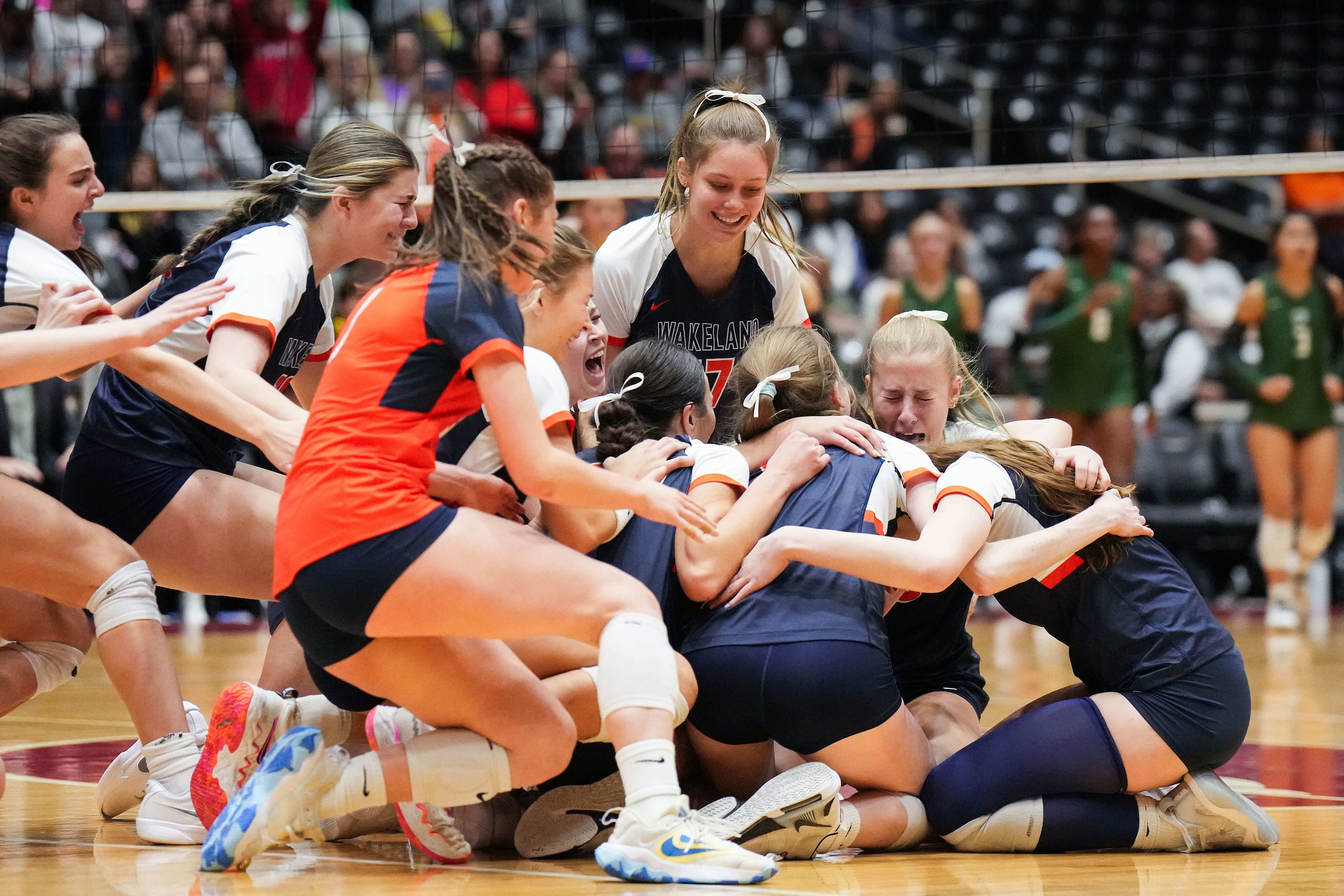 Frisco Wakeland's players celebrate match point in their victory over Cedar Park to win the...