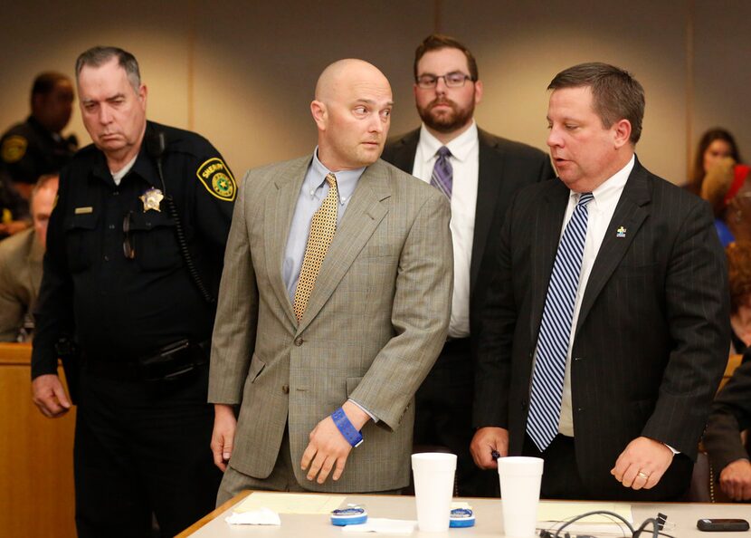 Roy Oliver, fired Balch Springs police officer, looks to his defense attorney Miles...