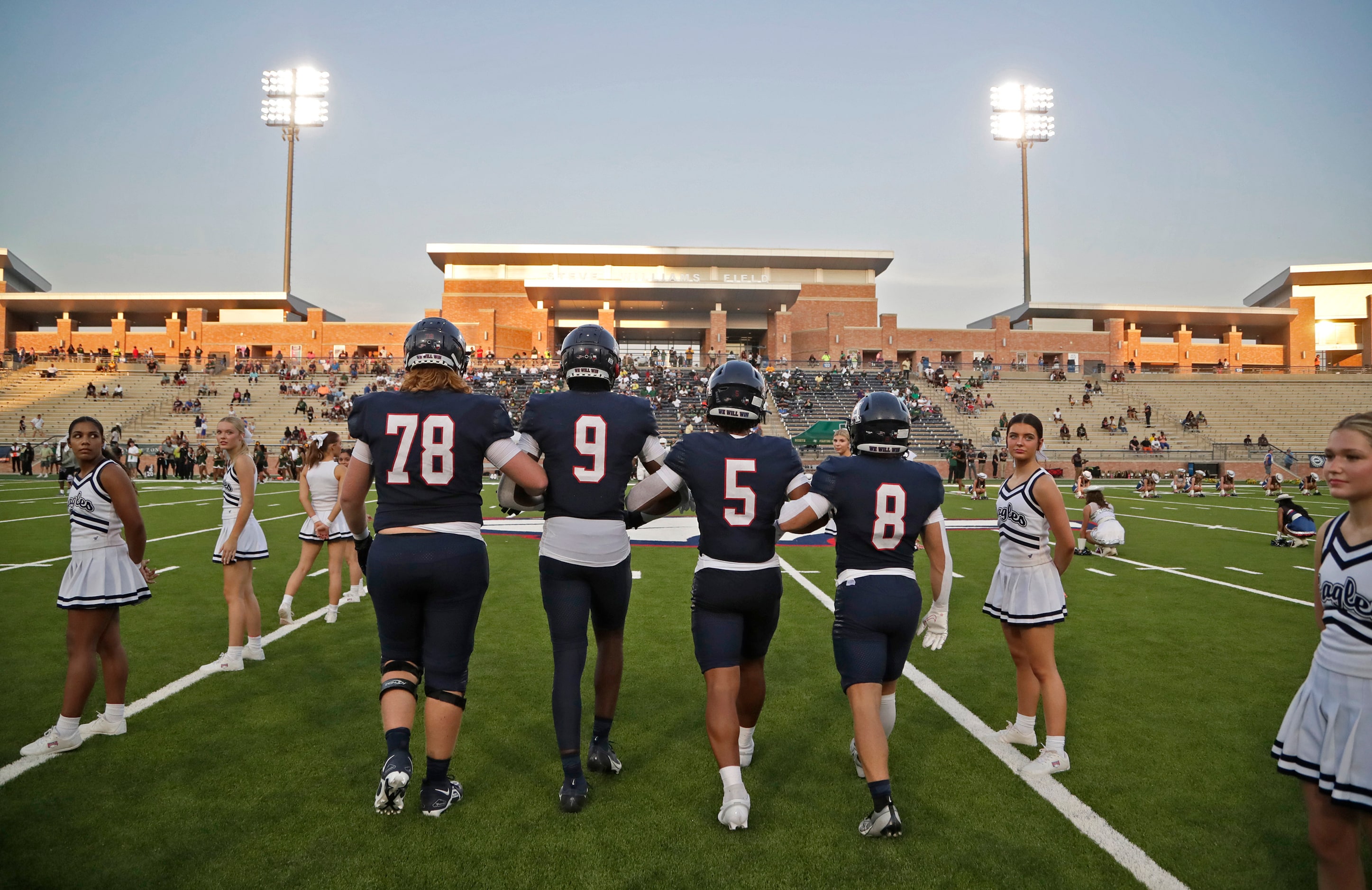 Allen High School captains head to the coin toss before kickoff as Allen High School hosted...