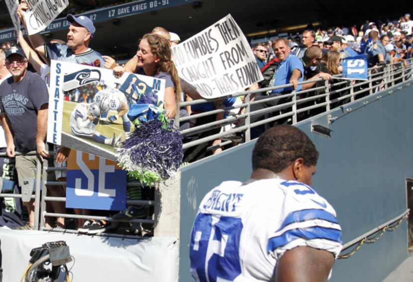 Seahawks fans use posters an a photo from a previous Seahawks playoff win to taunt Cowboys...