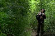 Rajiv Roy tries to identify a species during an excursion on World Migratory Bird Day on May...