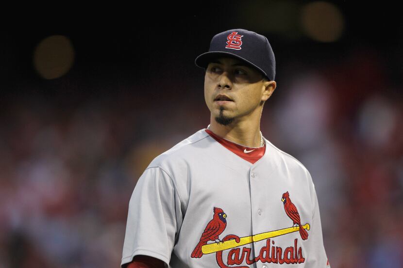 Starting pitcher Kyle Lohse (26) of the St. Louis Cardinals walks off the field after being...