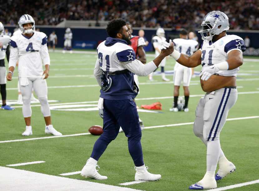 Dallas Cowboys running back Ezekiel Elliott (21) and Dallas Cowboys offensive guard Joe...