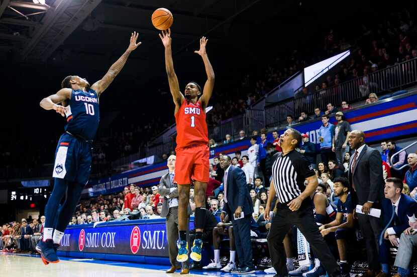 Southern Methodist Mustangs forward Feron Hunt (1) makes a three pointer over Connecticut...