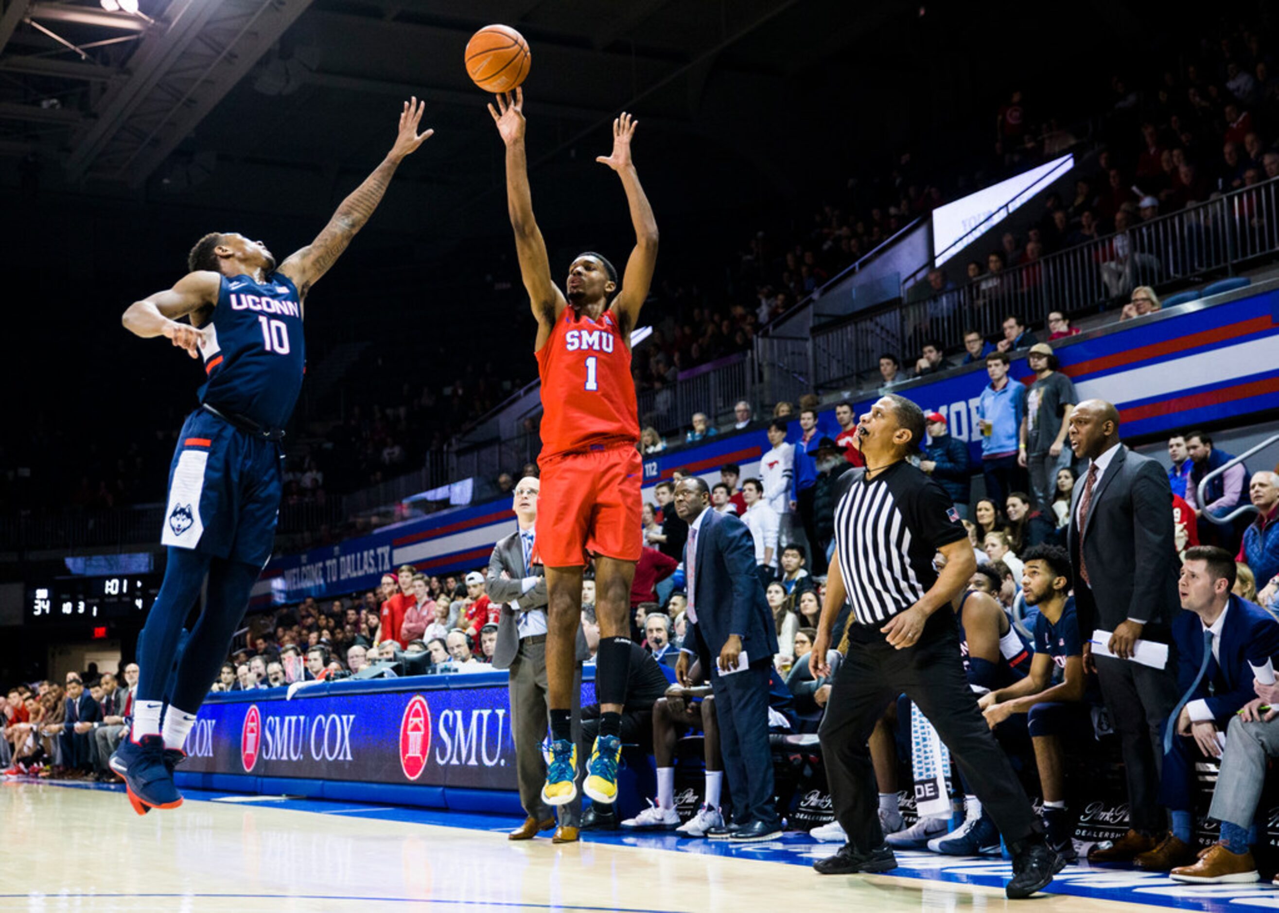 Southern Methodist Mustangs forward Feron Hunt (1) makes a three pointer over Connecticut...