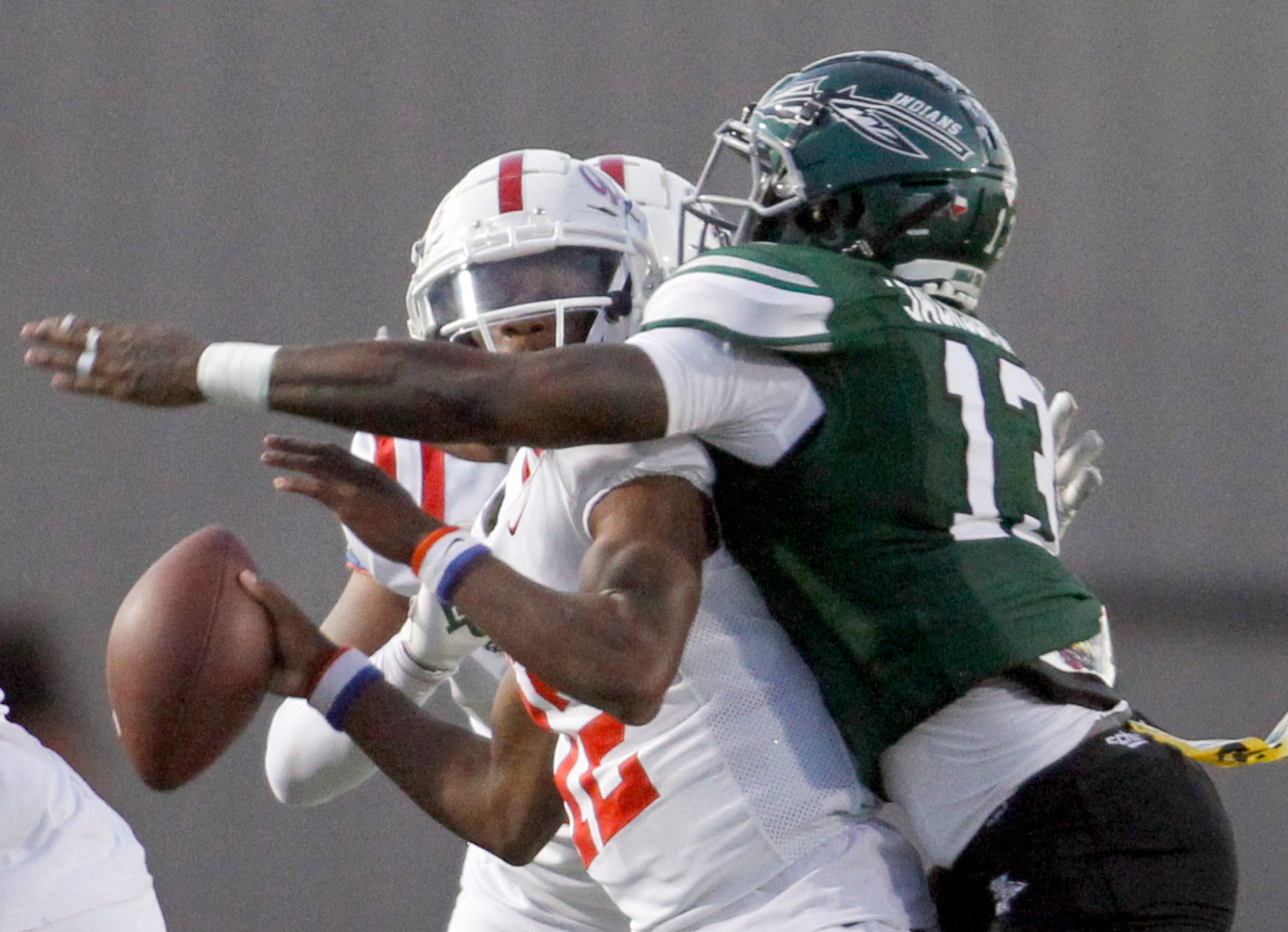 Duncanville quarterback Keelon Russell (12) is unable to get off a pass as he is sacked for...