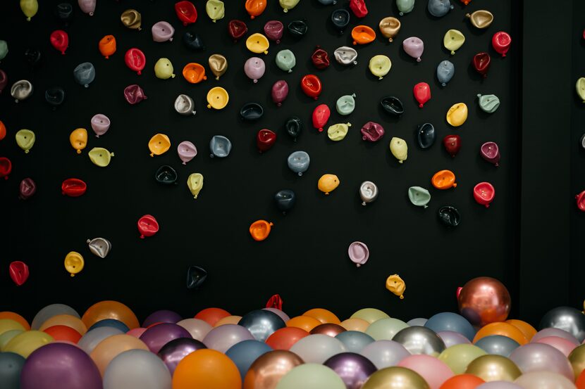 Jessica Bell’s “300 Balloons” features a wall covered with colorful balloon sculptures. Real...