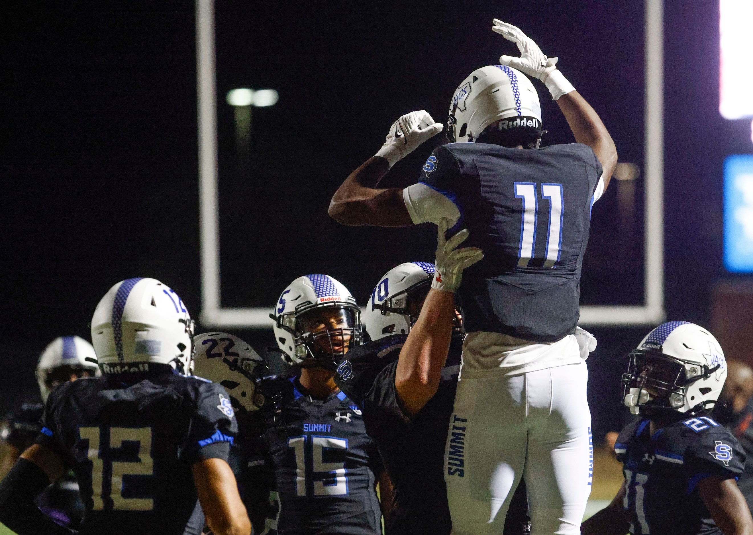 Mansfield Summit High’s Dorian Mcdade (11) celebrates a touchdown against Ennis High during...