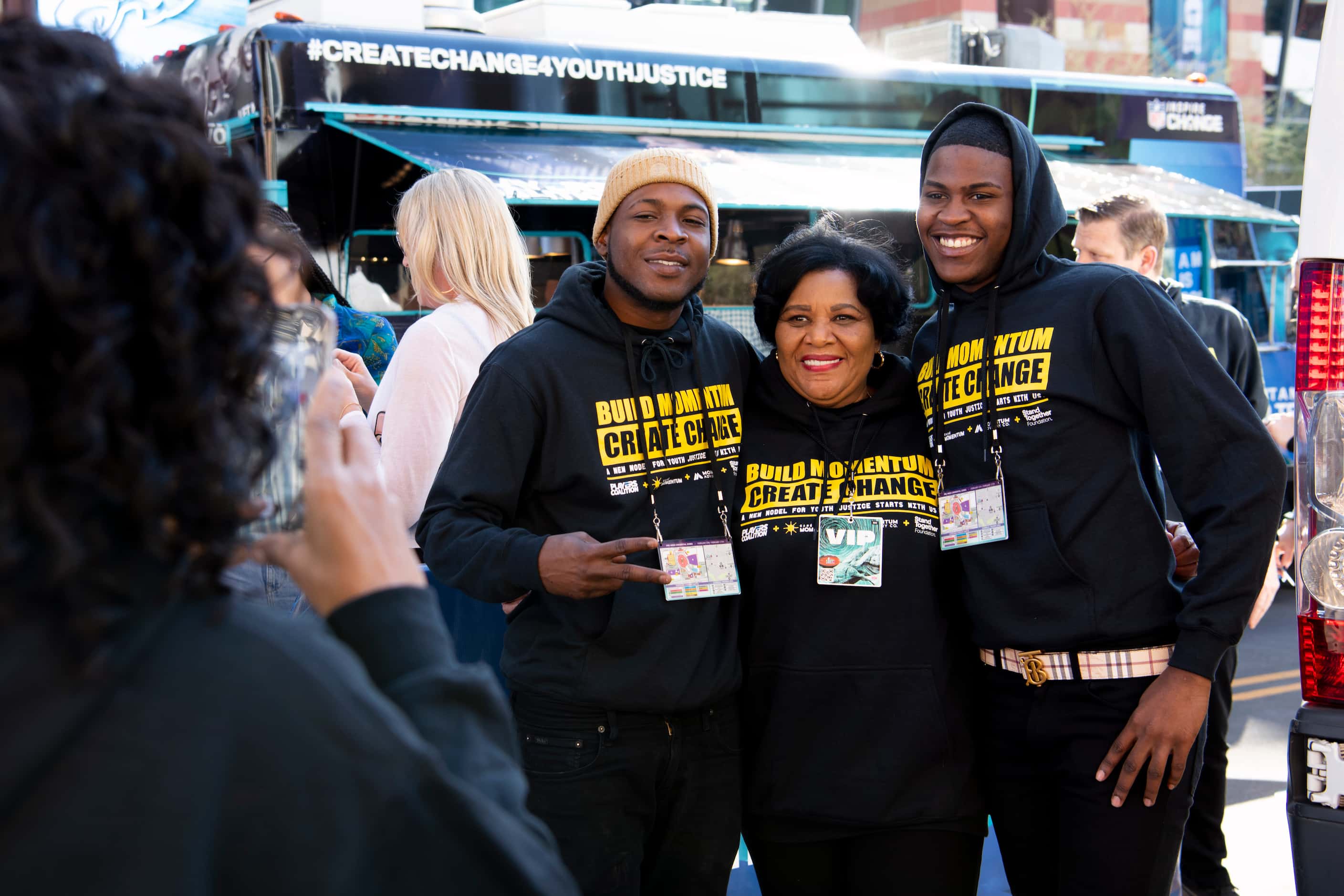 Two Cafe Momentum ambassadors join Alice Marie Johnson (center) at the Cafe Momentum food...