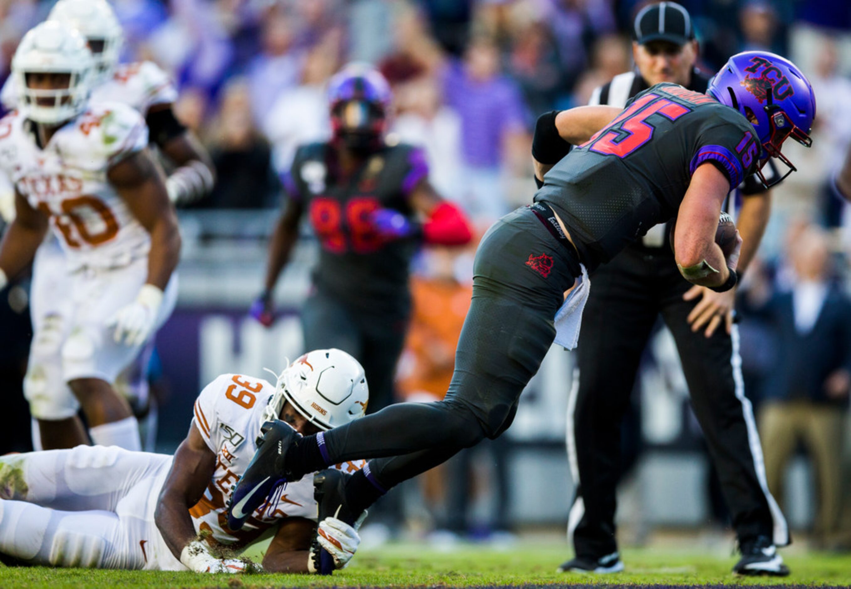 TCU Horned Frogs quarterback Max Duggan (15) falls in to the end zone for a touchdown while...