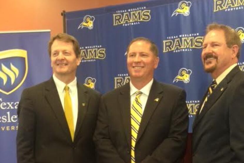 From left: Texas Wesleyan president Fred Slabach, new football coach Joe Prud'homme and...