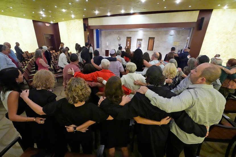 Worshipers sing as they pray for peace, during a Shabbat service, Friday, Sept. 27, 2024, at...