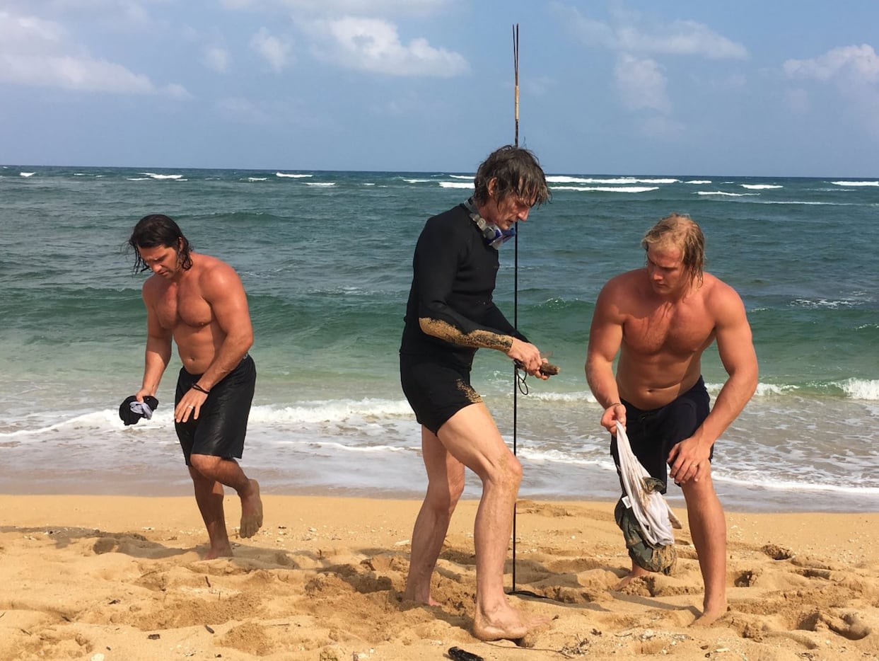 Ross (left), Kevin (middle) and Marshall (right) Von Erich roam about the beach after...