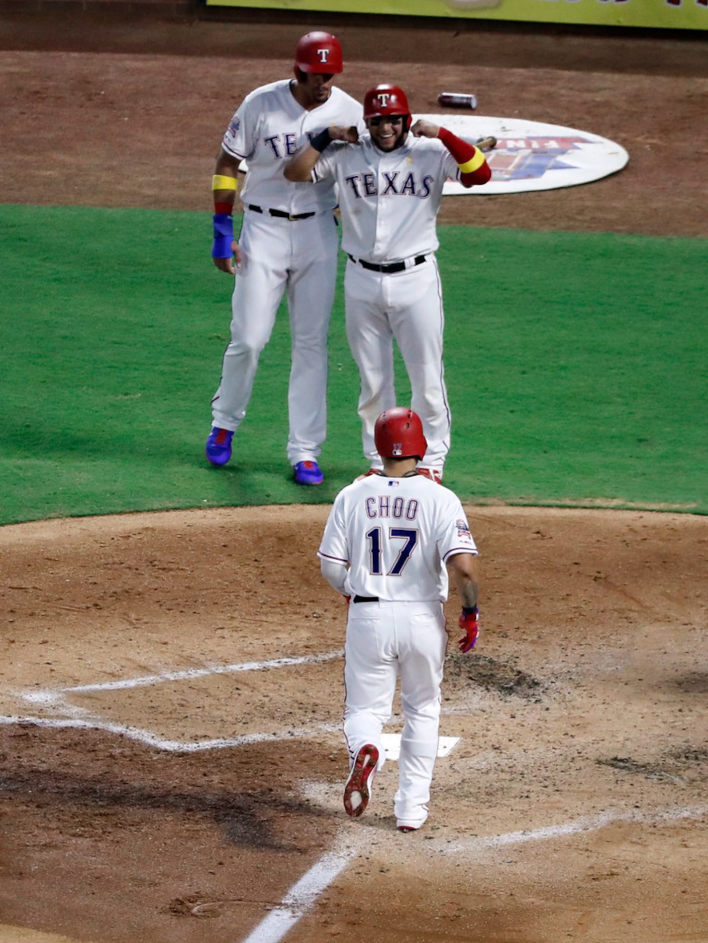 Texas Rangers' Shin-Soo Choo approaches the plate after hitting a three-run home run against...