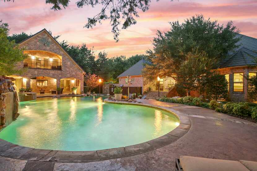 The five-bedroom, 5½-bathroom resort-style home at 8 Shadywood Lane in Melissa is offered...