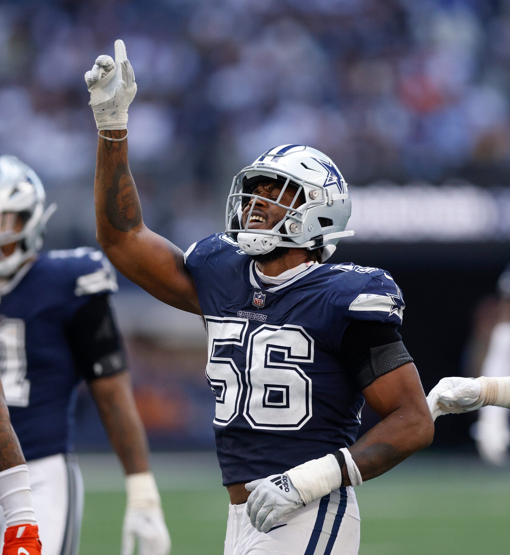 Dallas Cowboys defensive end Dante Fowler Jr. (56) celebrates after a tackle for loss during...