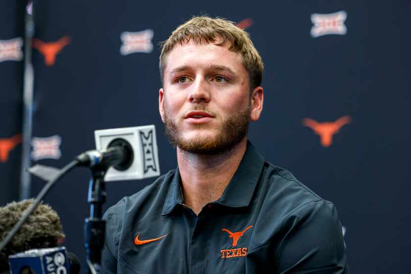 Texas quarterback Quinn Ewers speaks with reporters during the Big 12 Media Days at AT&T...