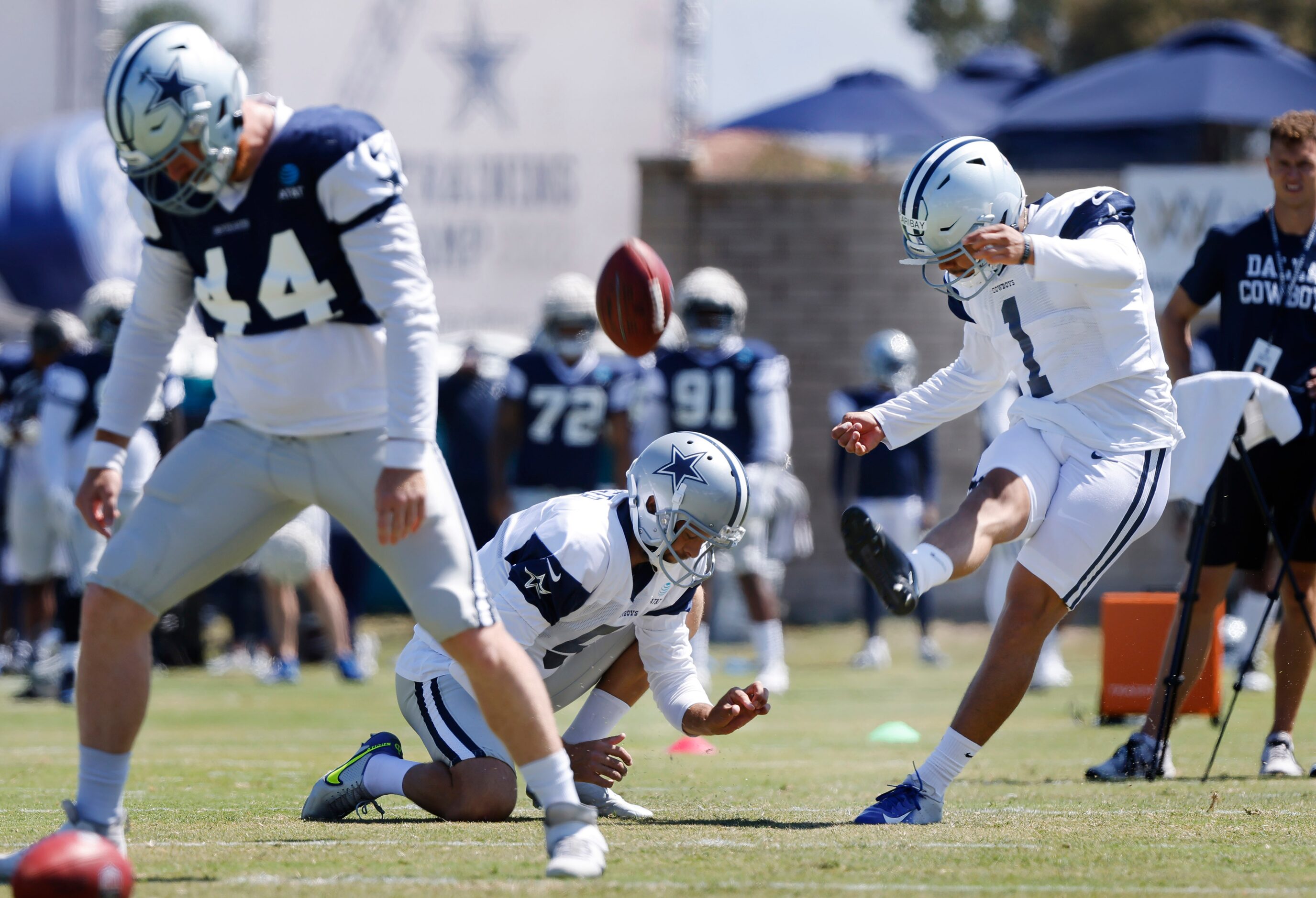 Dallas Cowboys kicker Jonathan Garibay (1) kicks field goals on snaps from long snapper Jake...