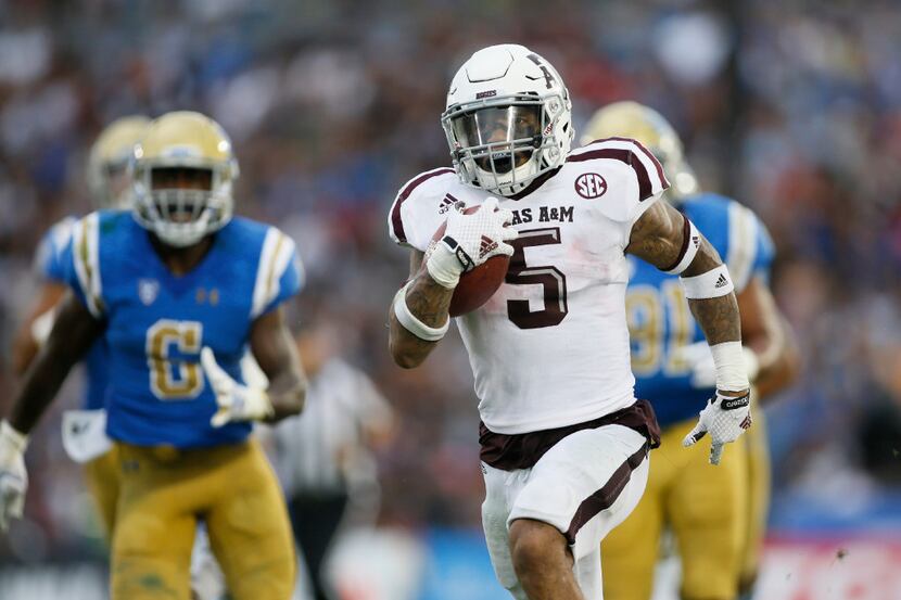 Texas A&M running back Trayveon Williams runs for a 61 yards touchdown against UCLA during...