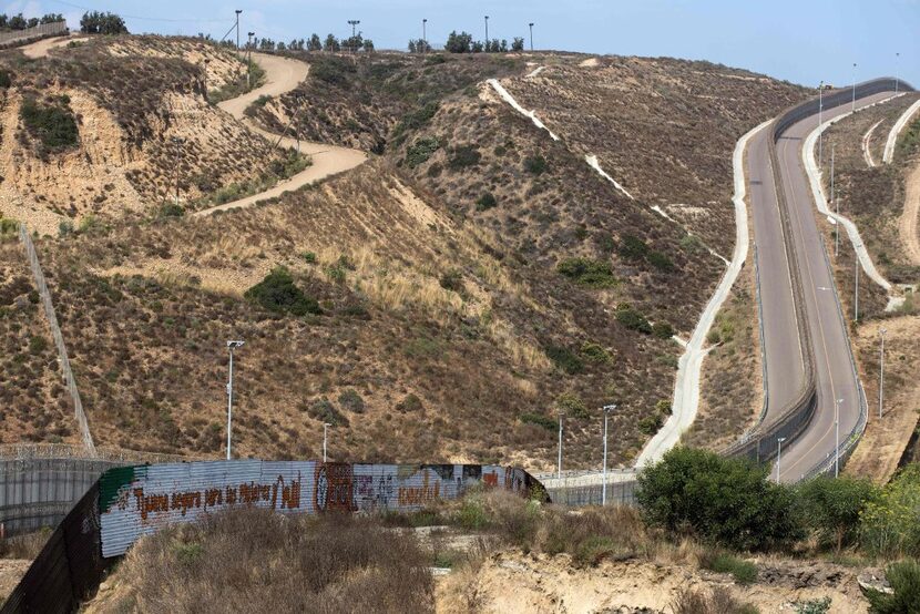 Partial view of the U.S.-Mexico border wall painted by members of the Brotherhood Mural...