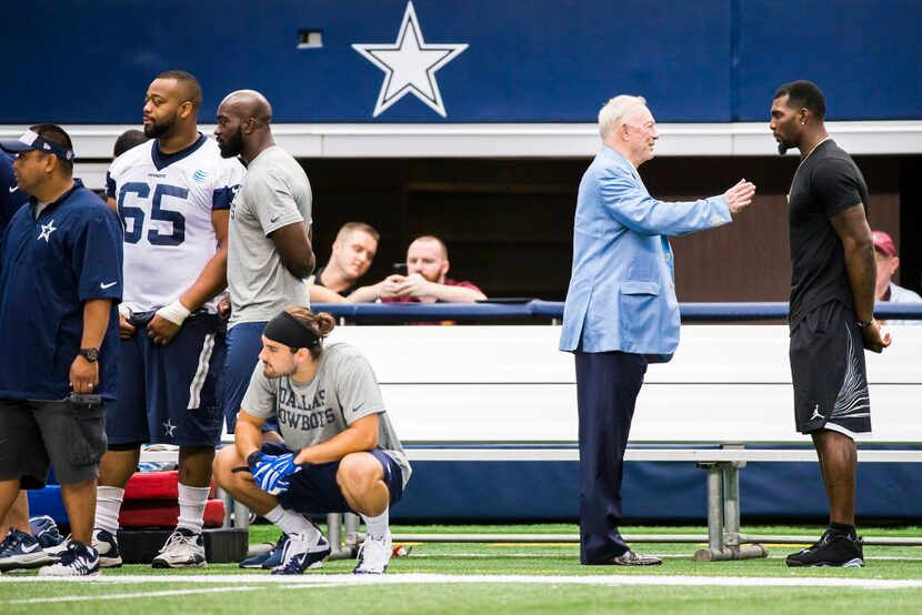 Dallas Cowboys wide receiver Dez Bryant (right) talks with team owner Jerry Jones on the...