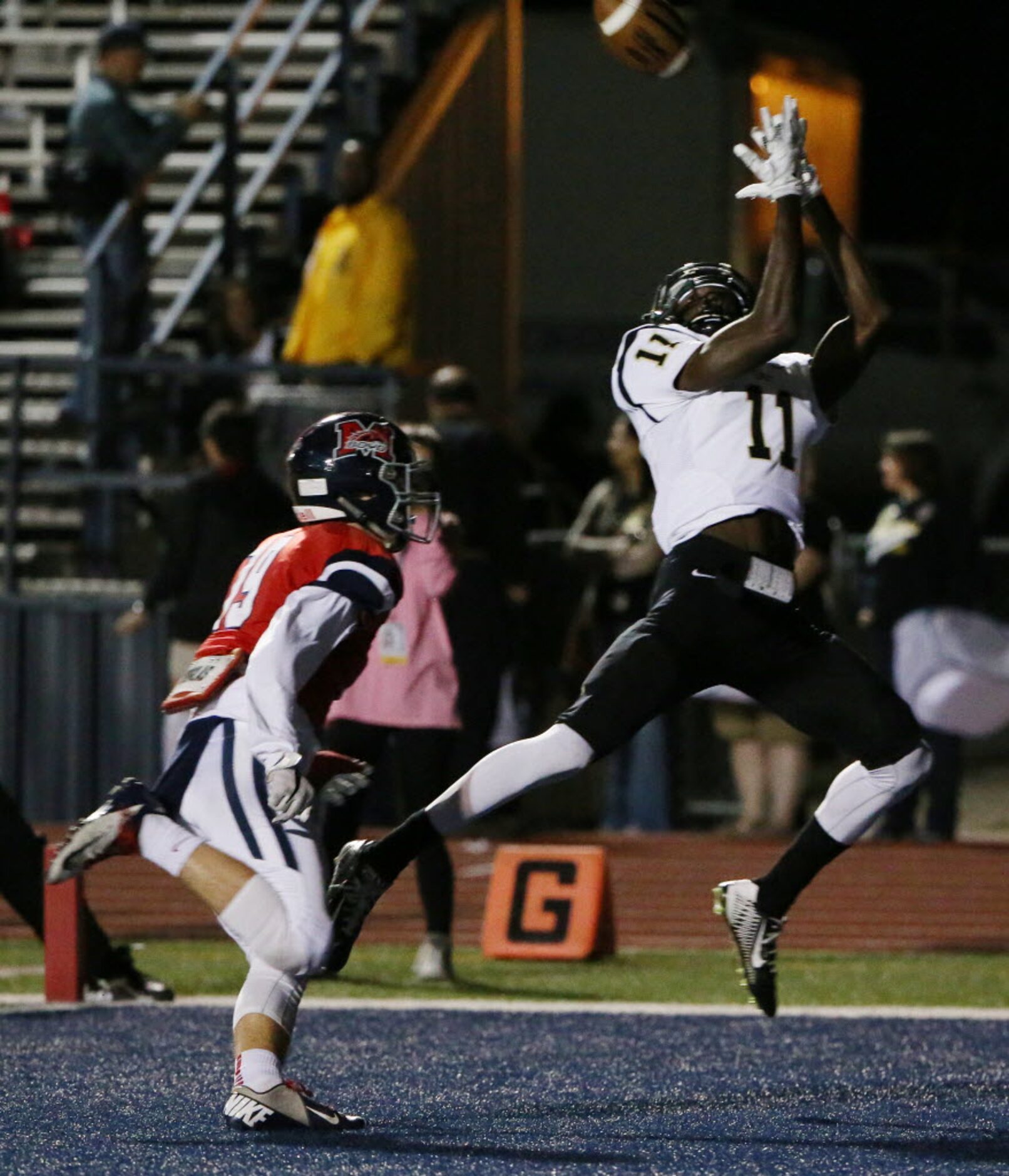 Plano East wide receiver Audie Omotosho (11) catches a touchdown in the end zone over...