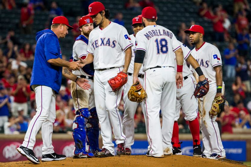 Texas Rangers starting pitcher Yu Darvish (11) is pulled from the game by Texas Rangers...