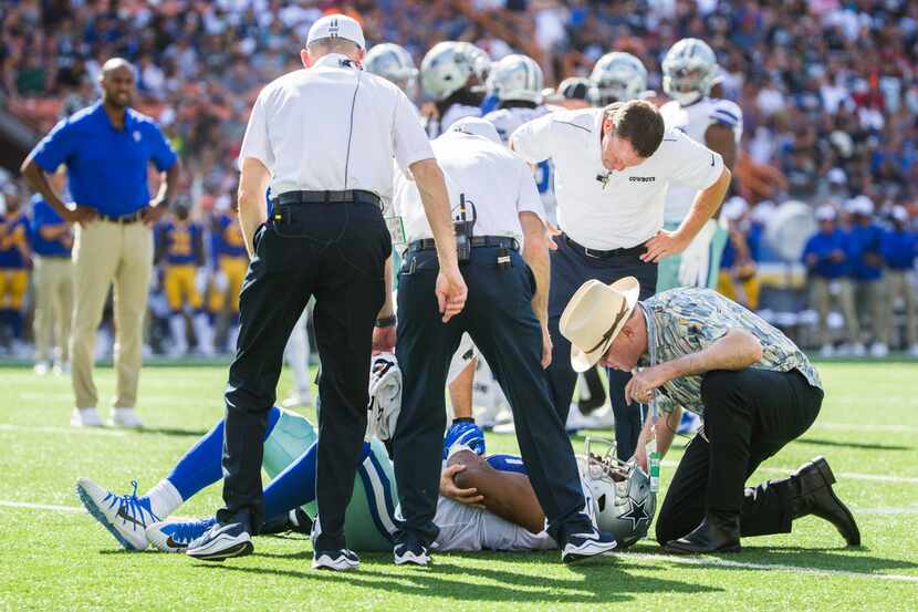 Dallas Cowboys linebacker Chris Covington (59) lays hurt on the field during the first...